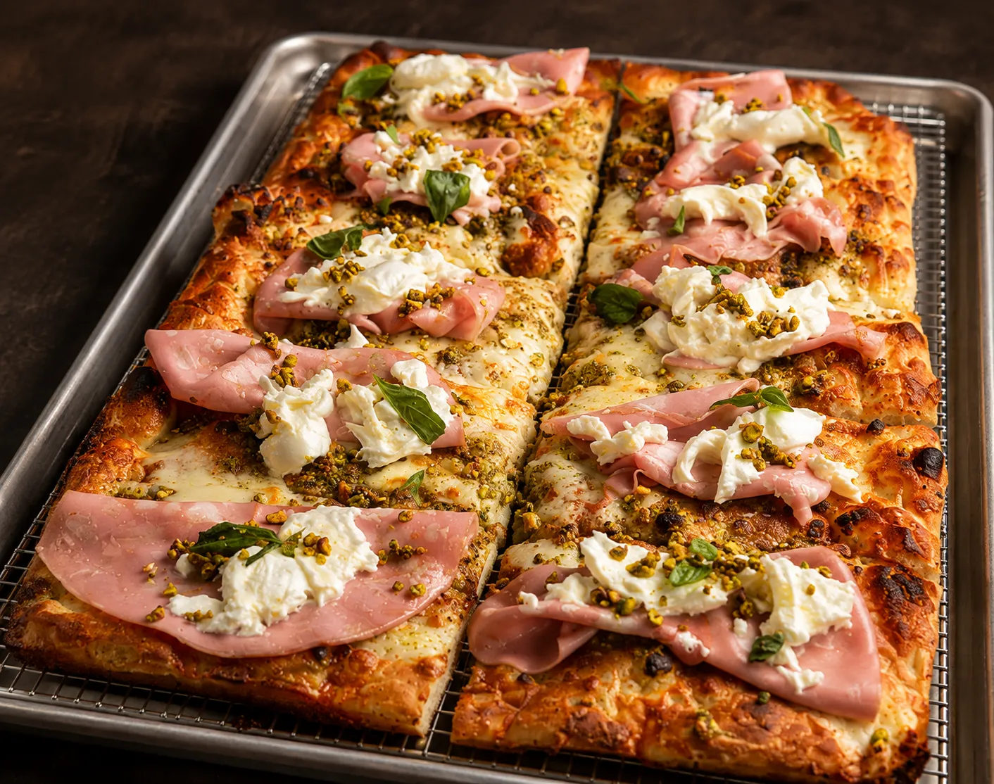 Mortadella, pistachio and burrata Roman style pizza with honey at Castelli Mercato Italian bakery in Ancaster, Hamilton